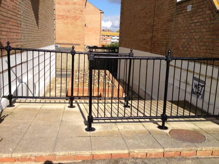 Newly redecorated and restored black railings.