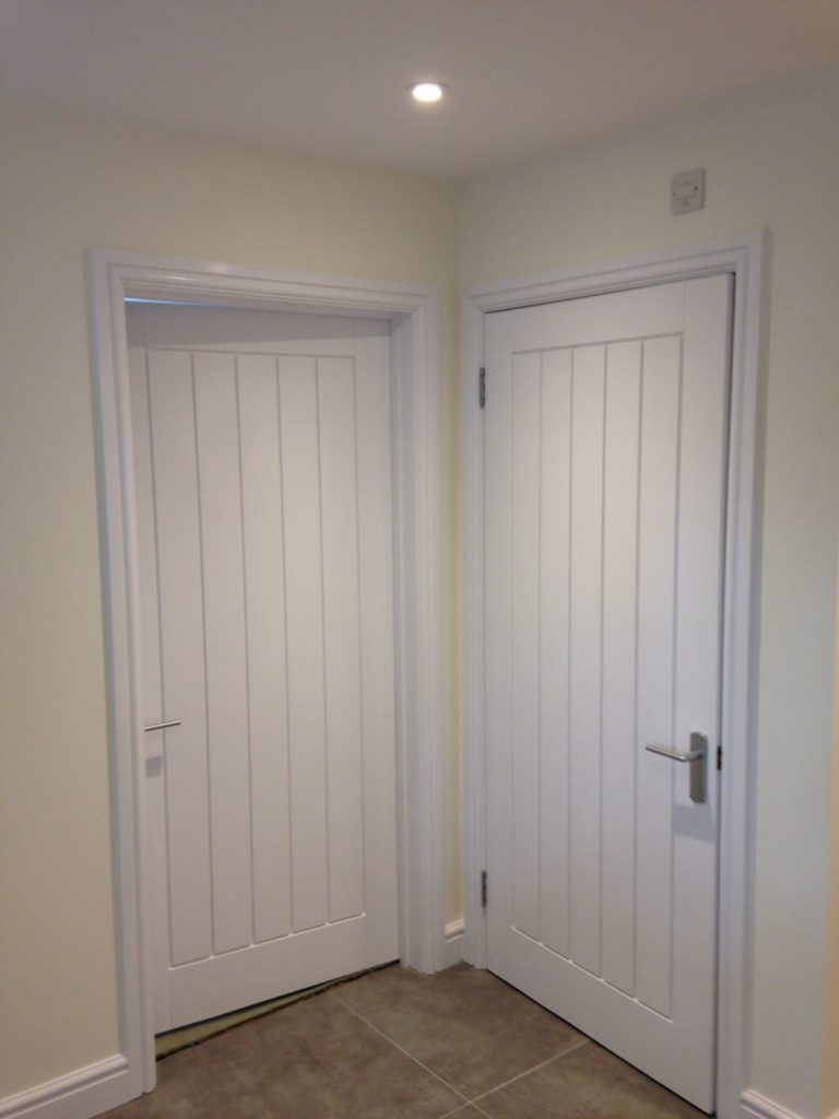 White doors and white skirtings freshly painted. Redecorated ceiling and walls.