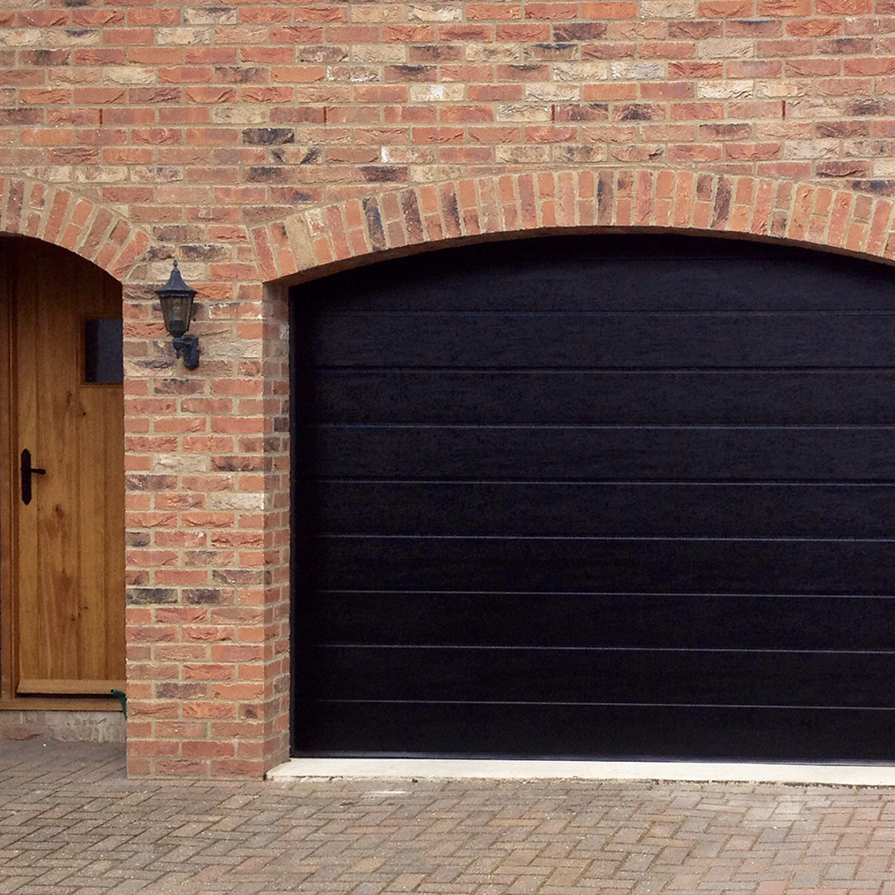 Single Insulated Woodgrain (Black) M-Ribbed Sectional Garage Door.