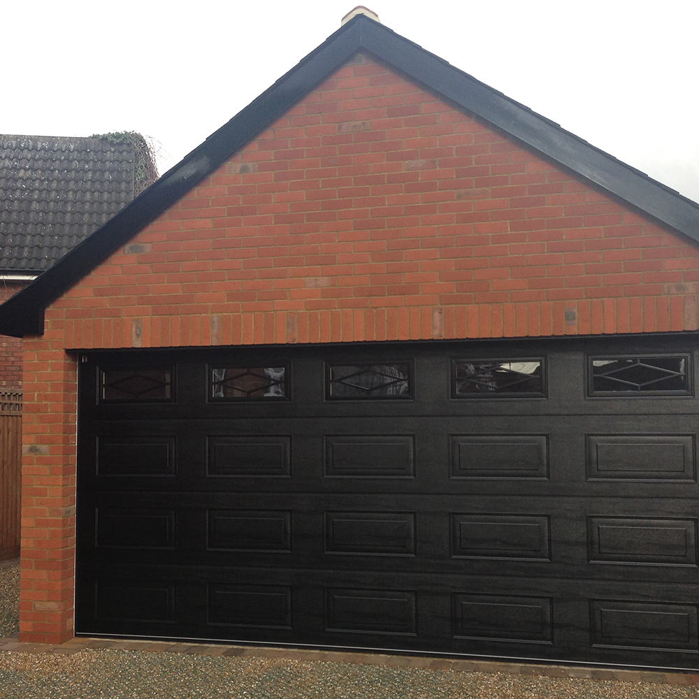 Double Insulated Georgian Woodgrain (Black) Sectional Garage Door with Rhombus Windows.