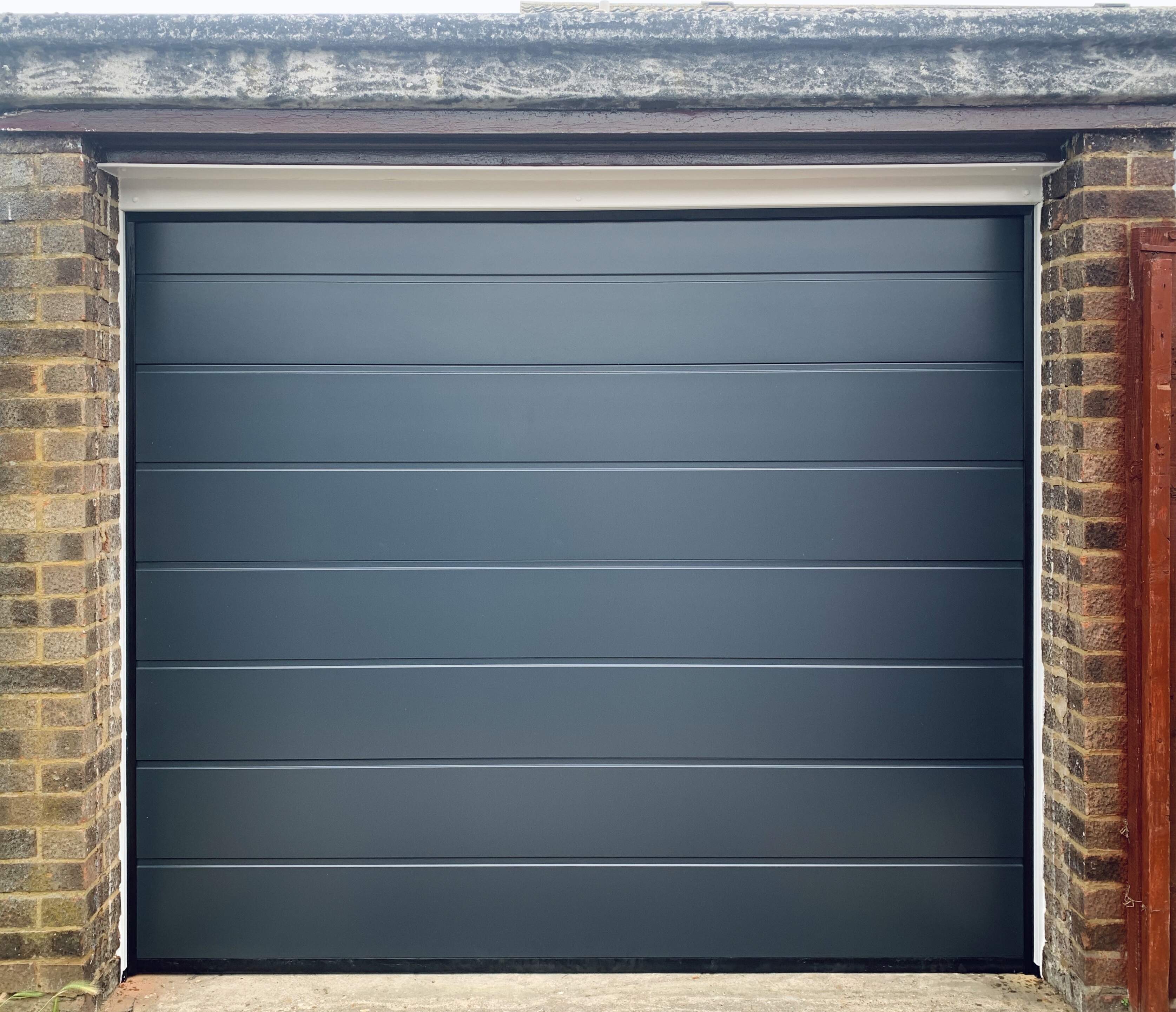 Single Insulated Smooth (Anthracite Grey) M-Ribbed Sectional Garage Door.