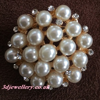 gold coloured brooches