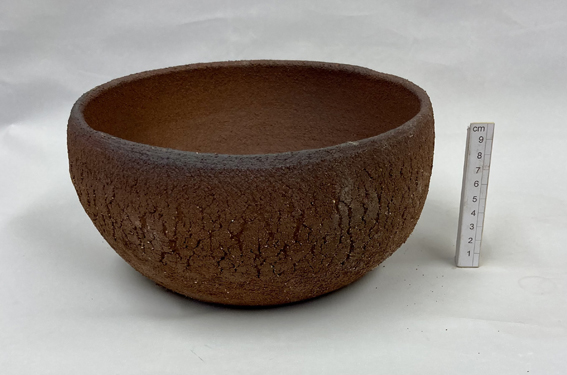 un-glazed coarse red stoneware clay with an oxide wash detail