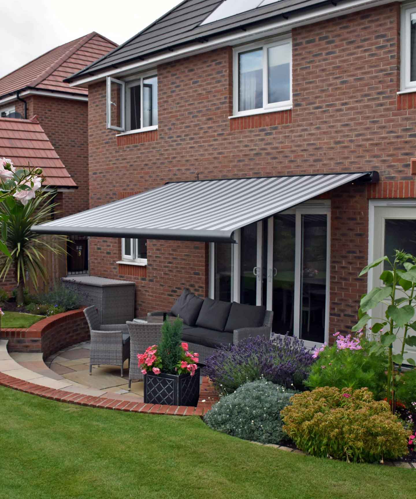 A high quality awning covering a sunny patio area