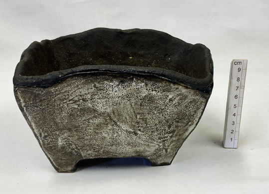 slab built in a coarse buff and black stoneware clay