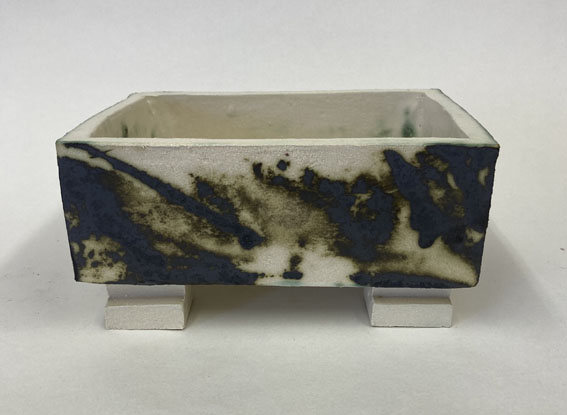 slab built white stoneware clay with copper oxide detail