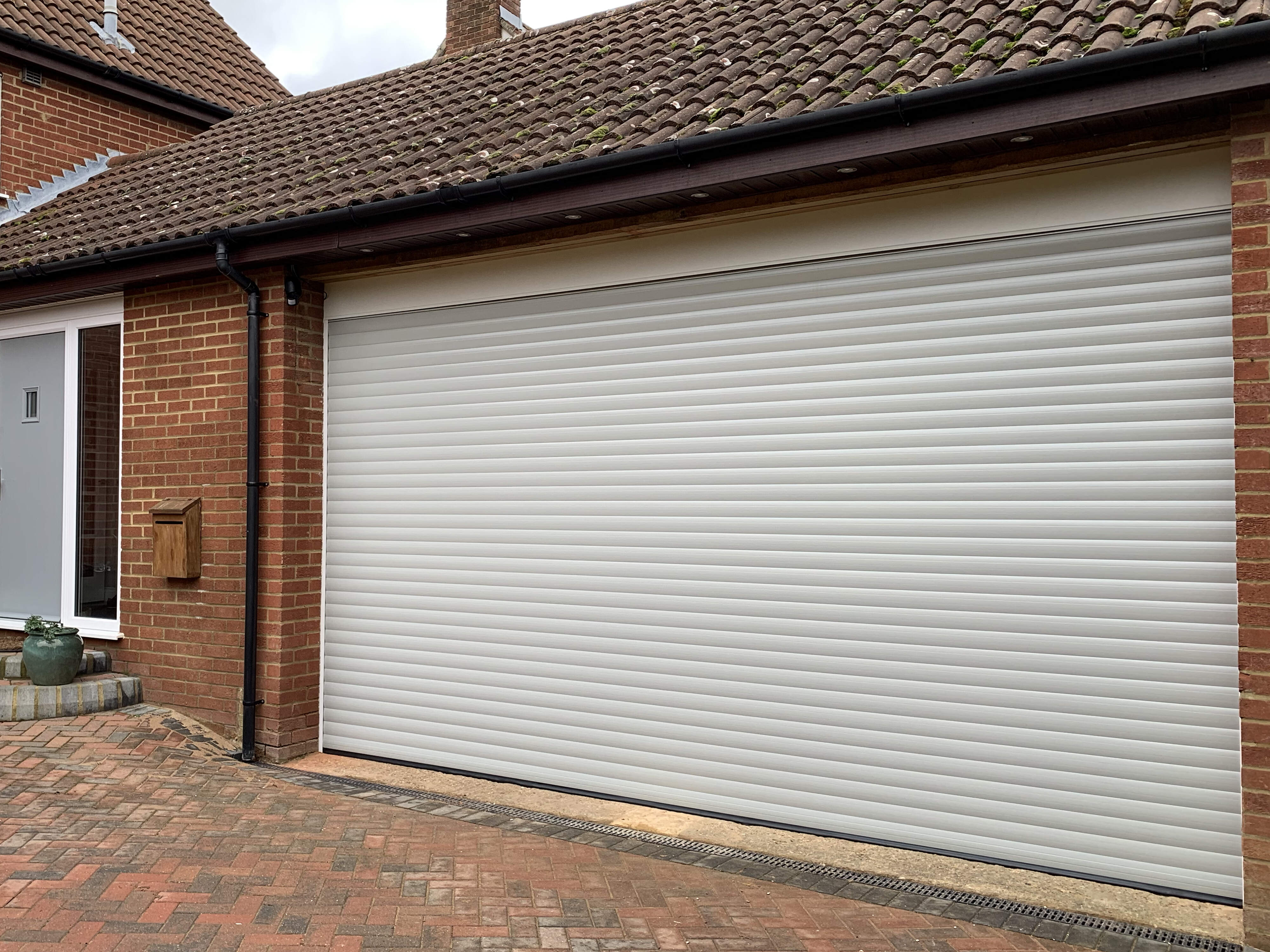 Double Insulated 77mm Lath (Agate Grey) Roller Shutter Garage Door with White Frame.
