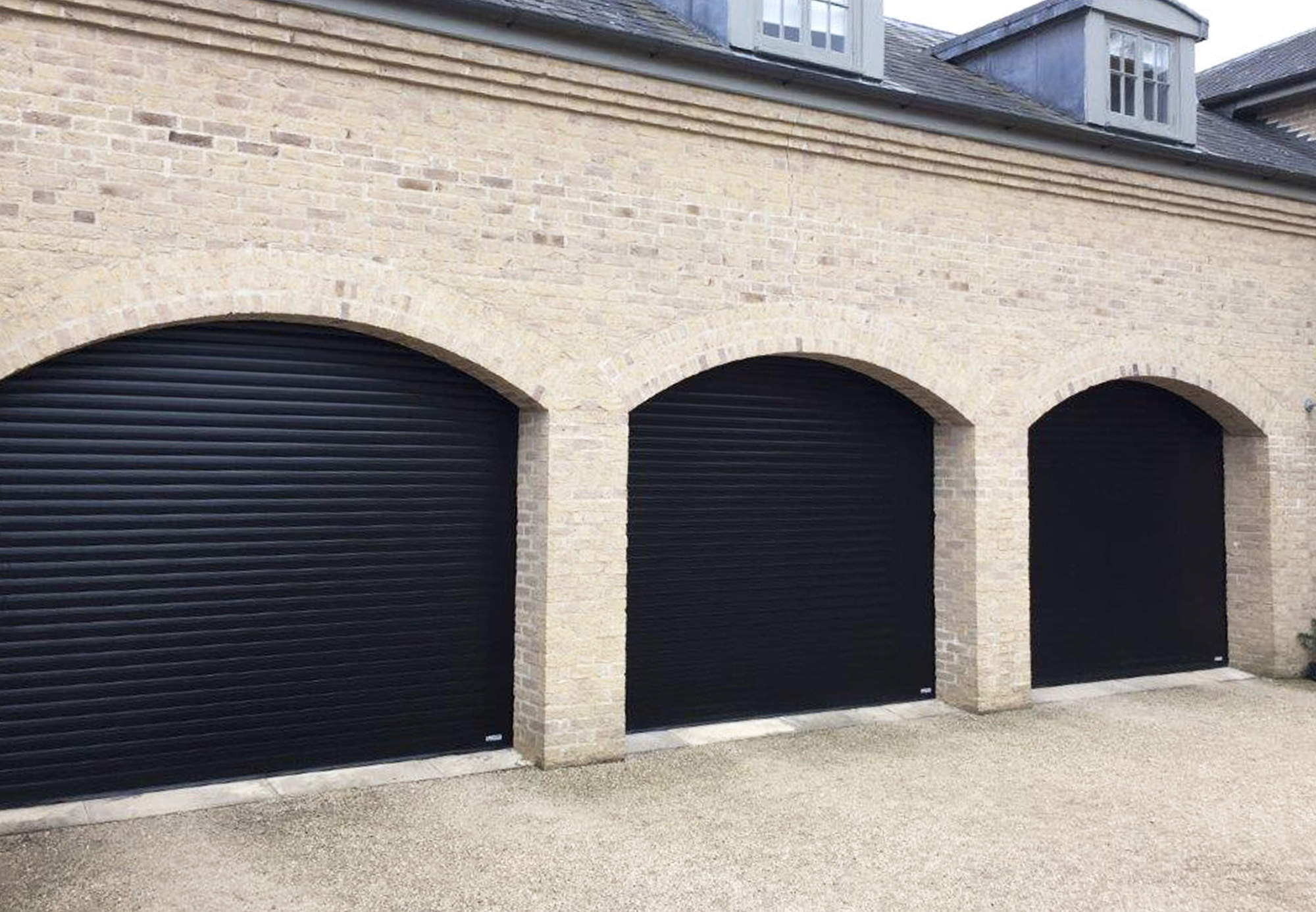 Black 77mm roller shutter garage doors.