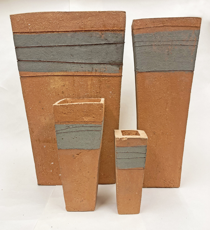 un-glazed coarse stoneware terracotta clay with an oxide wash detail