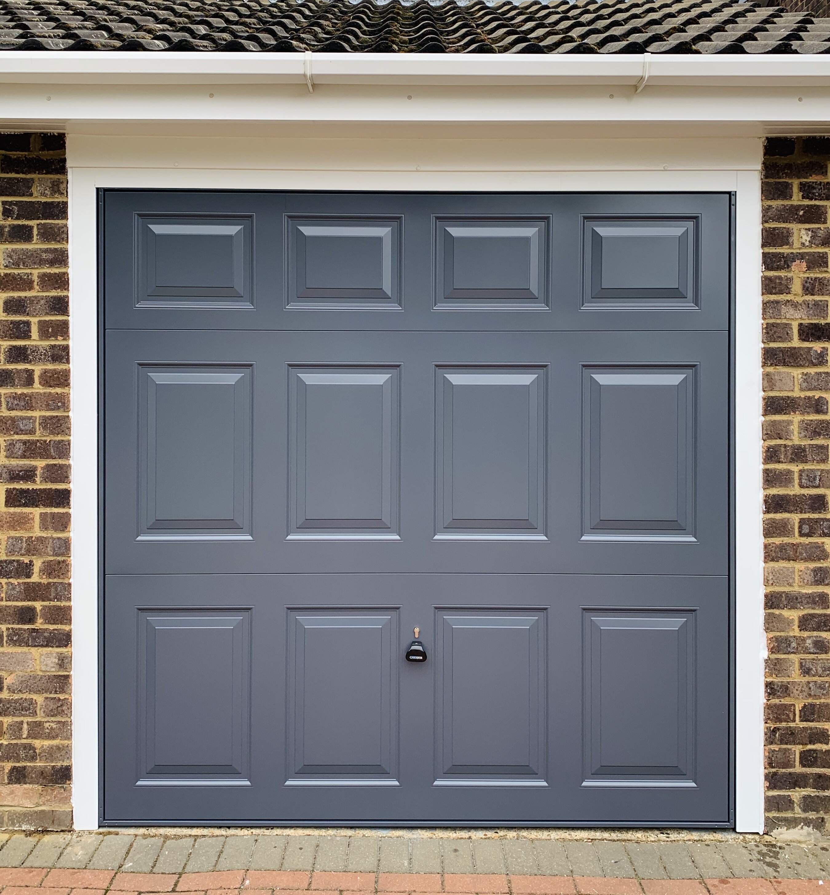 Single Steel (Slate Grey) Beaumont Retractable Garage Door with White Frame.