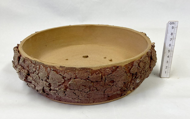 hand-thrown in a coarse buff and red  stoneware clay
