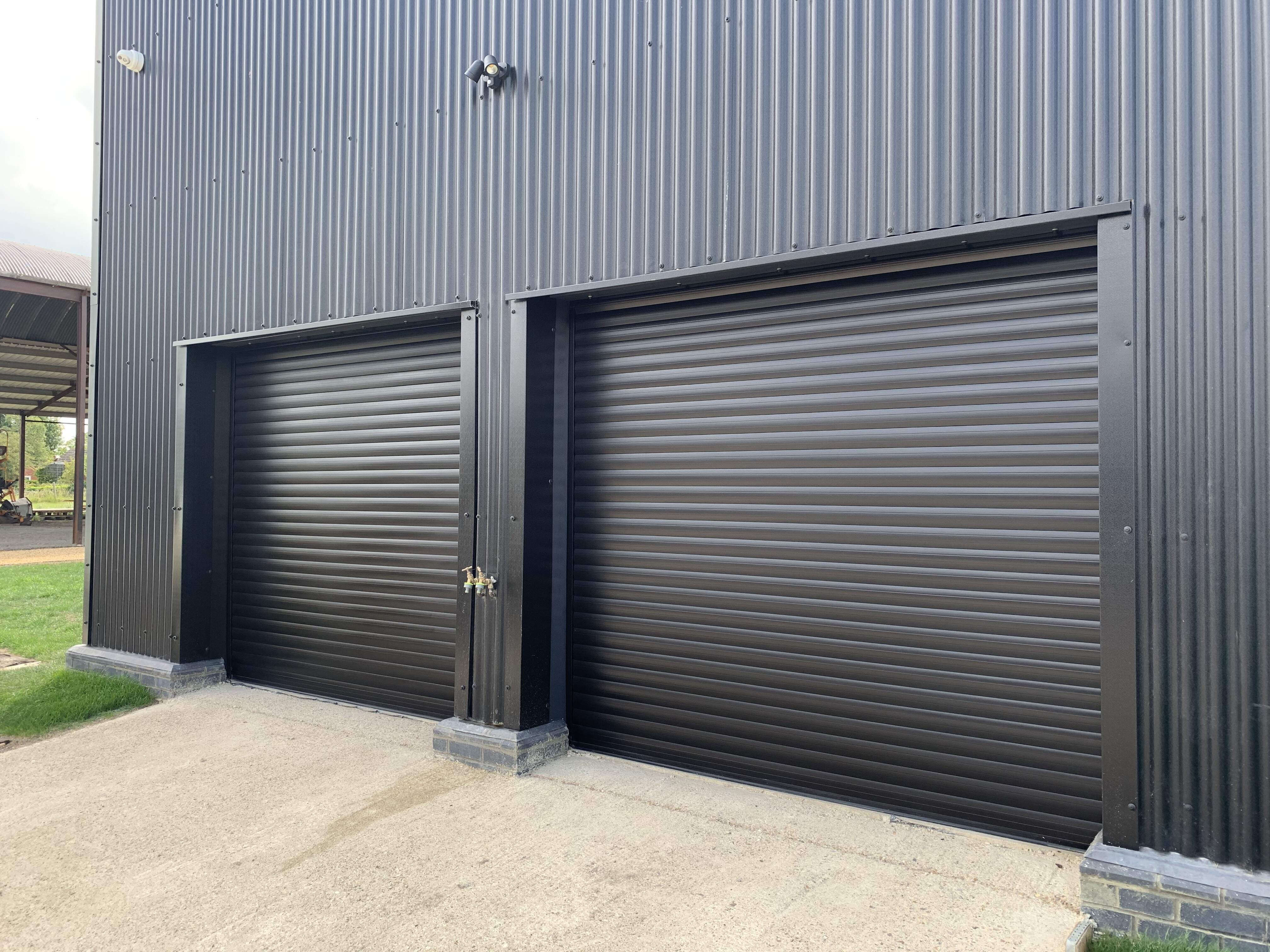 Single Insulated 77mm Lath (Black) Roller Shutter Garage Doors.