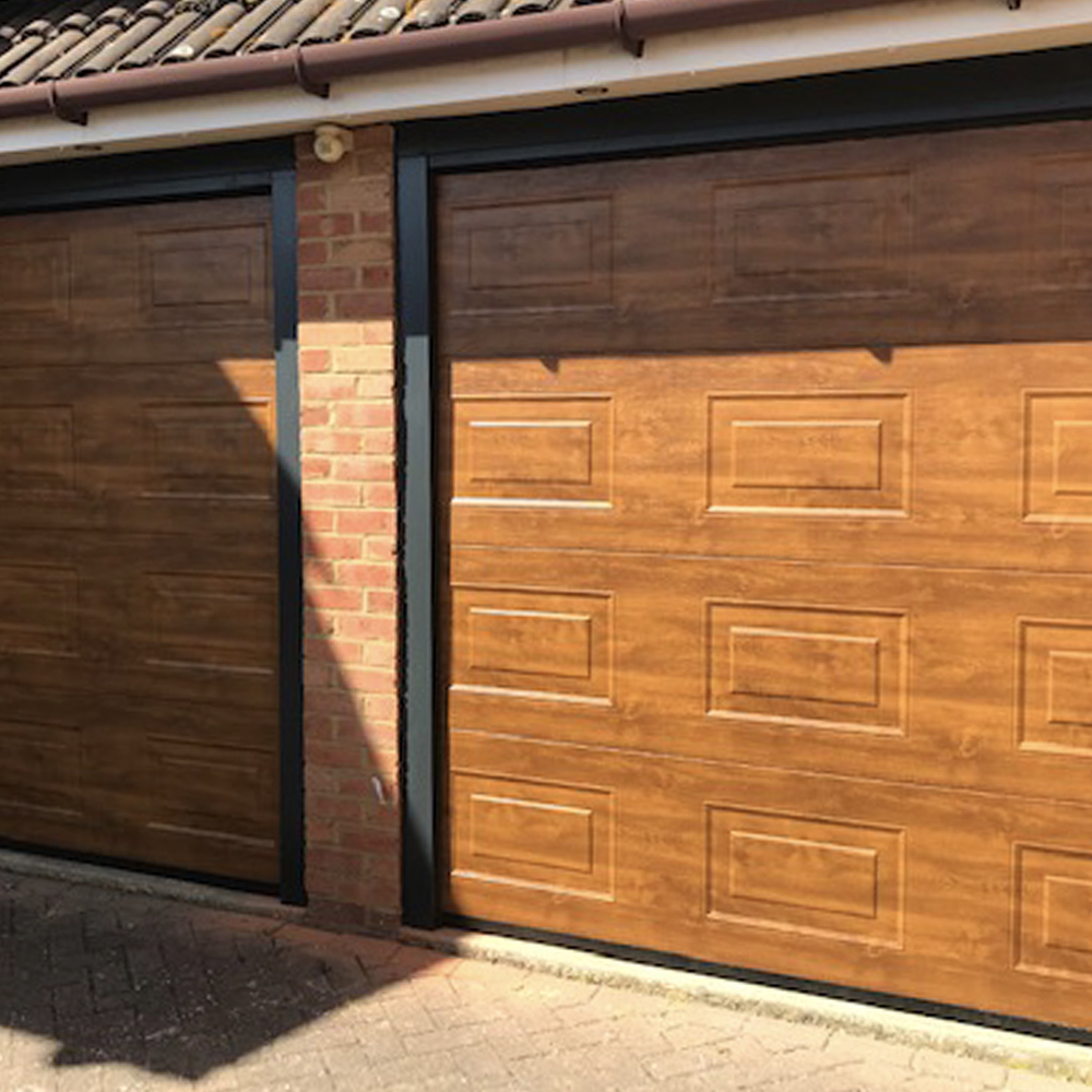 Single Insulated Georgian Woodgrain (Golden Oak) Sectional Garage Doors.