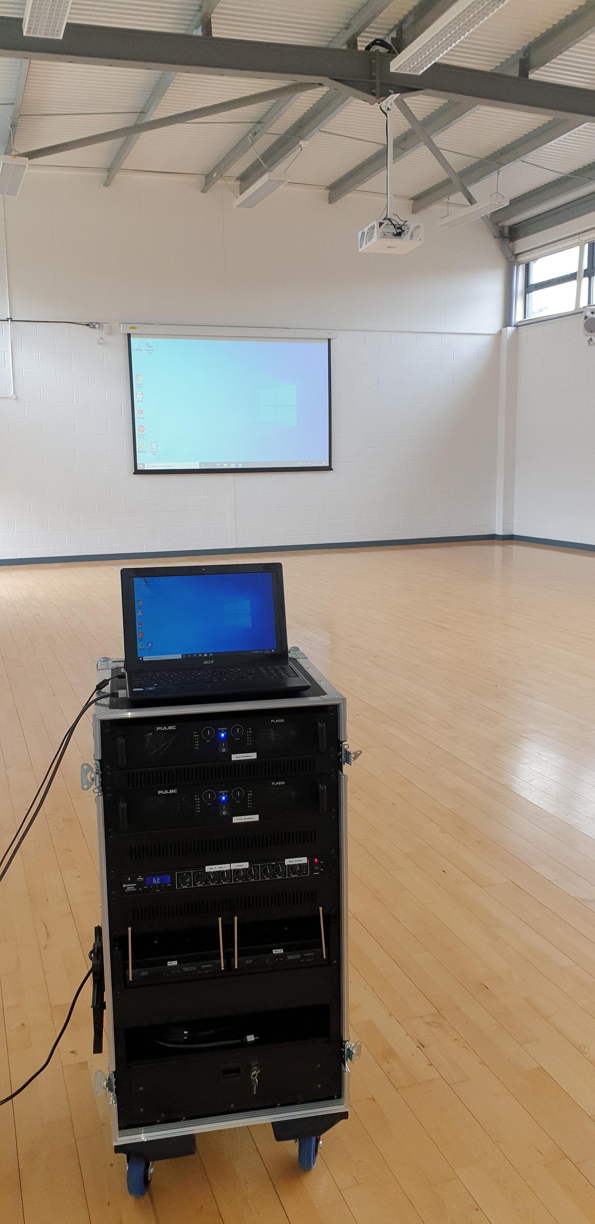 Large 3mtr electric projection screen, projector and mobile audio system.