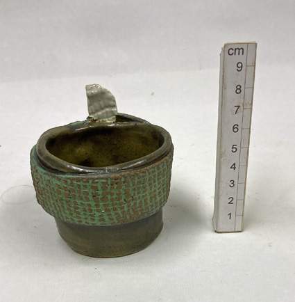 hand-thrown stoneware clay with a green glaze