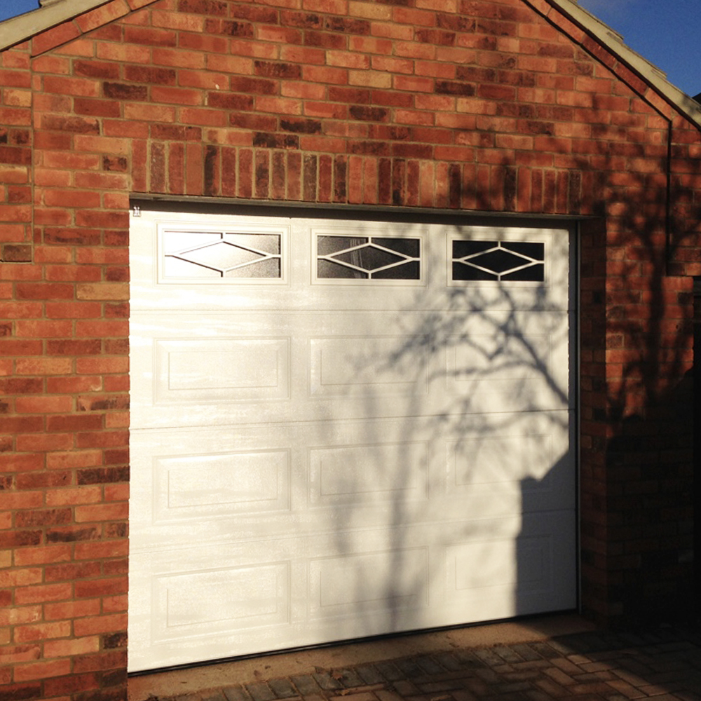 Single Insulated Georgian Woodgrain (White) Sectional Garage Door with Rhombus Windows.