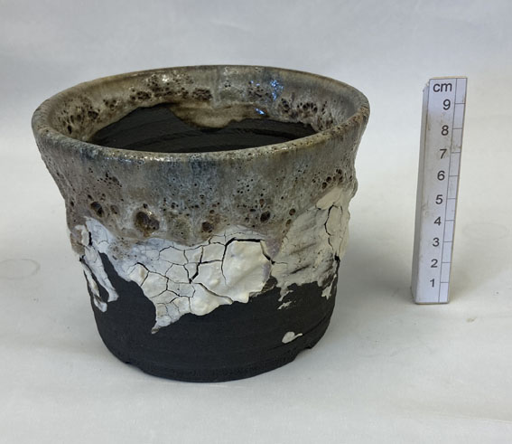 un-glazed coarse black stoneware clay with applied porcelain