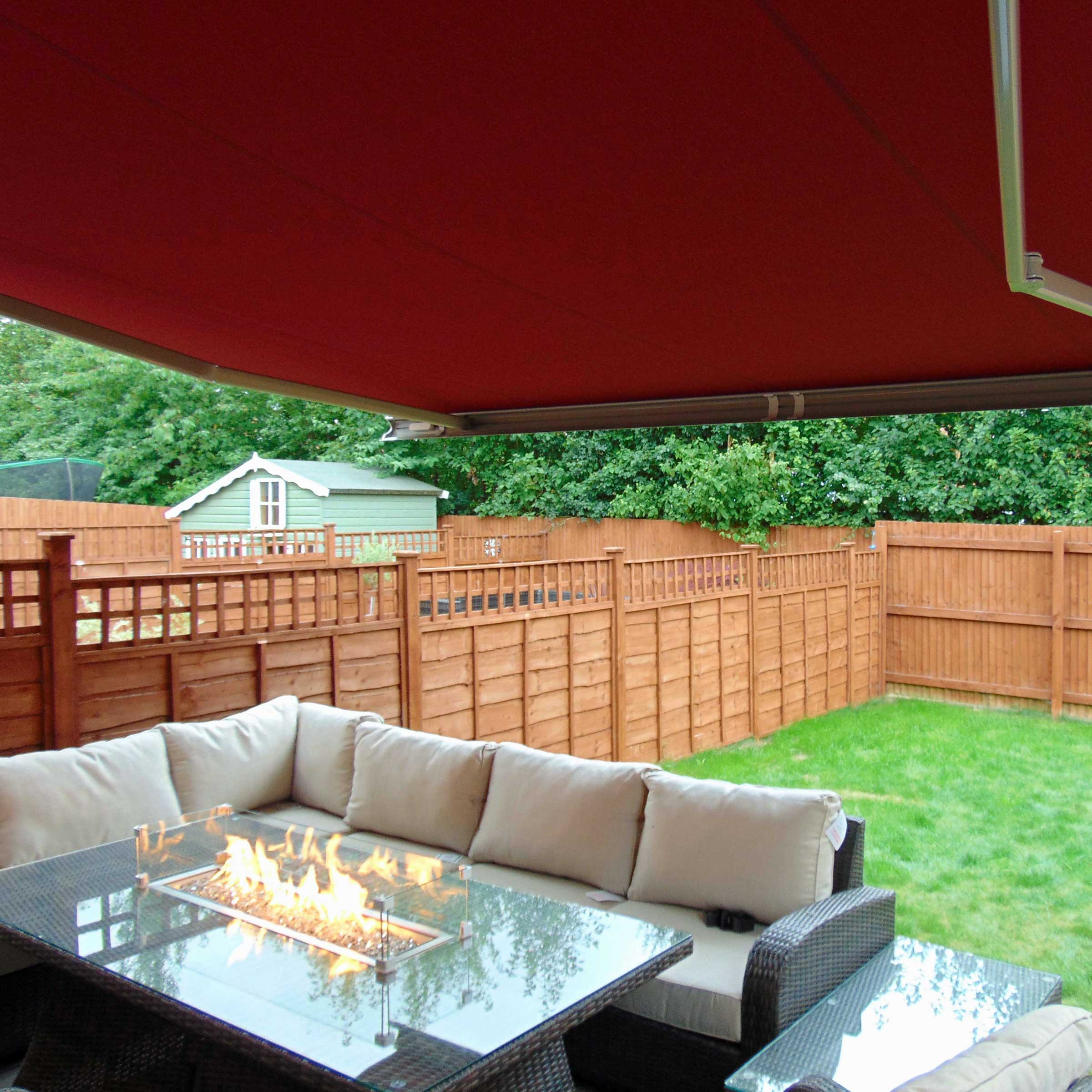 An impressive patio area covered by an Alcas Awning