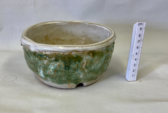 hand-thrown stoneware clay with a white and green glaze