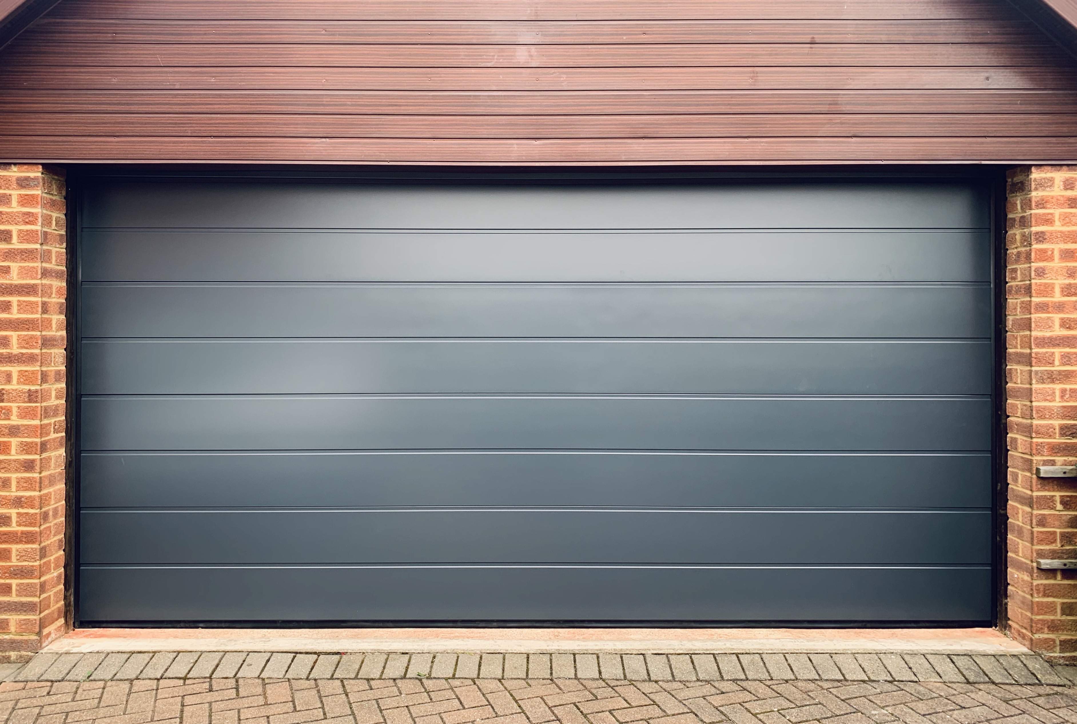 Double Insulated Smooth (Anthracite Grey) M-Ribbed Sectional Garage Door.