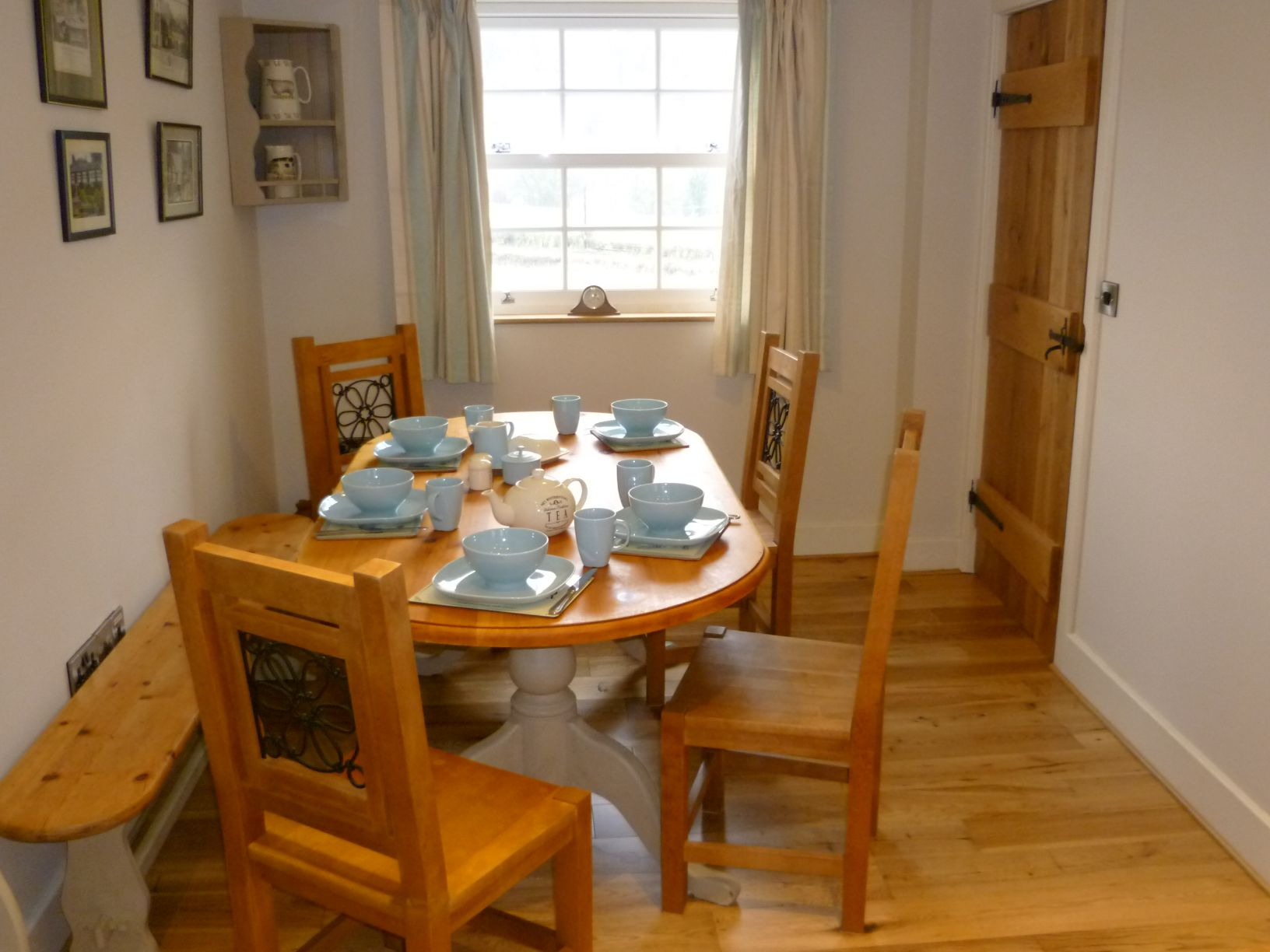 The dining table with chairs and a bench for up to 8 guests