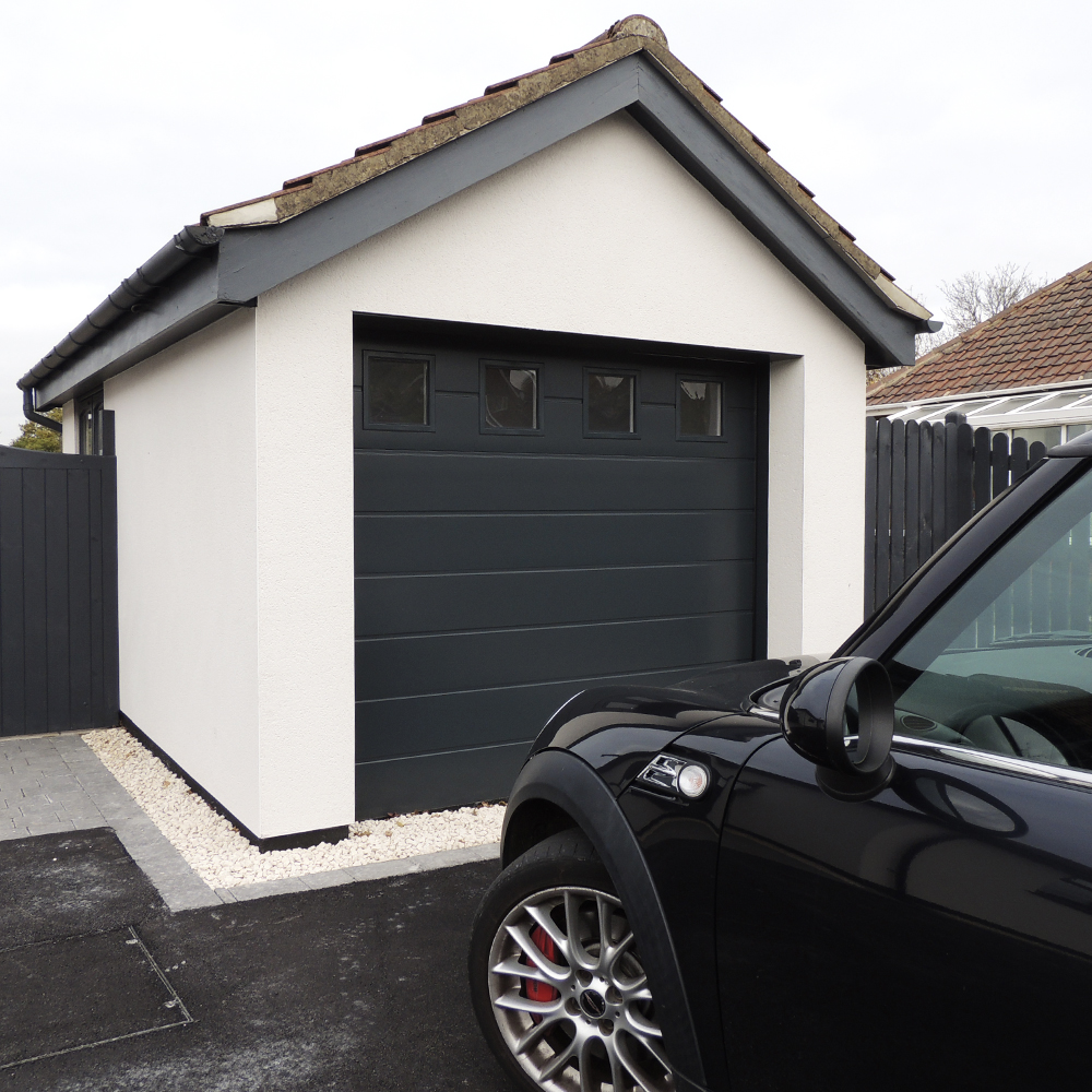 Single Insulated Smooth (Anthracite Grey) M-Ribbed Sectional Garage Door with Windows.