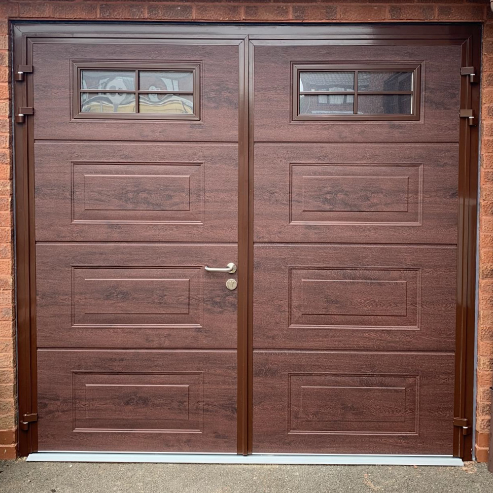 Georgian style side hinge garage door with windows finished in a rosewood effect.